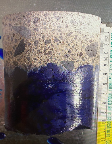 Conrcete penetrated 1.5 inches resists dye shown in core sample.